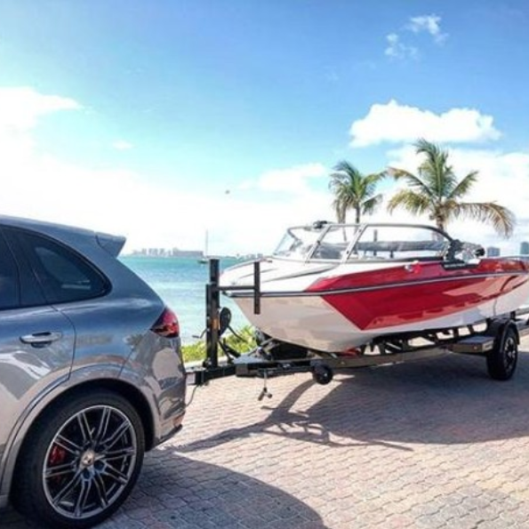 Boat being safely towed by a tow truck